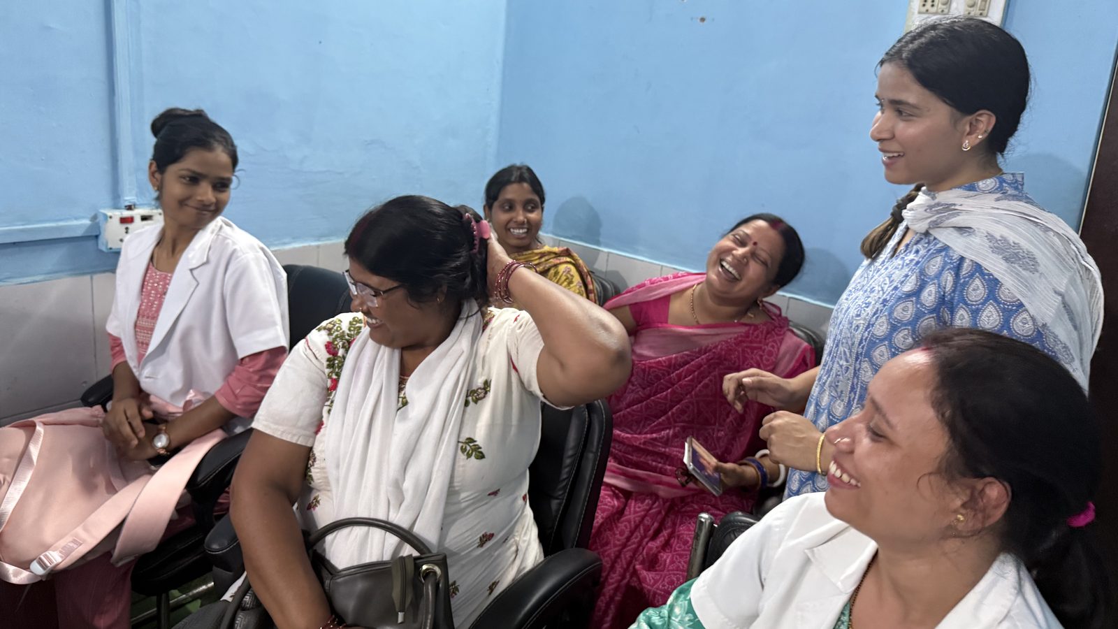 Women from the NGO network Naaadai partners with, sharing a laugh together